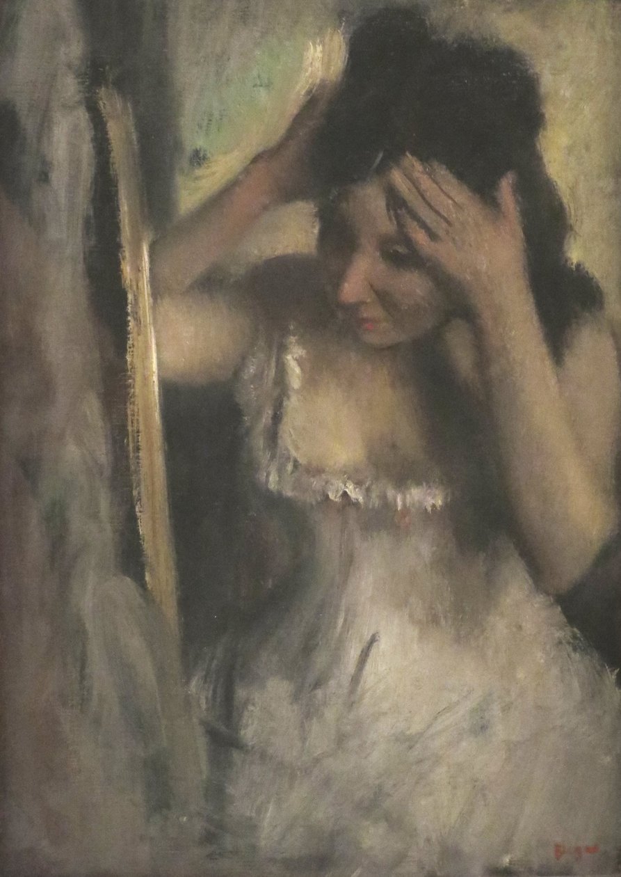 Femme se peignant devant un miroir - Edgar Degas