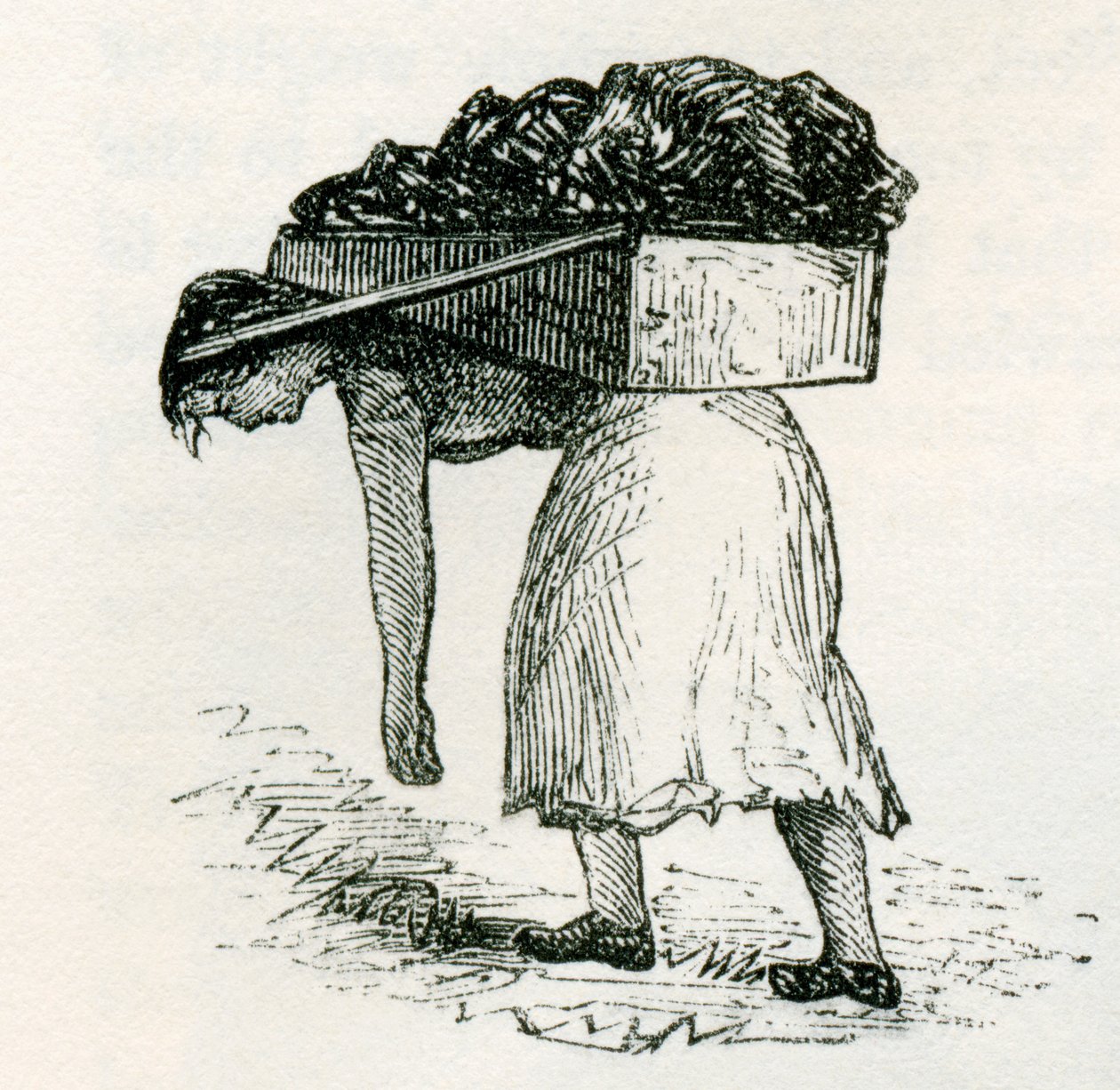 Femme portant du charbon à la surface dans les mines de l