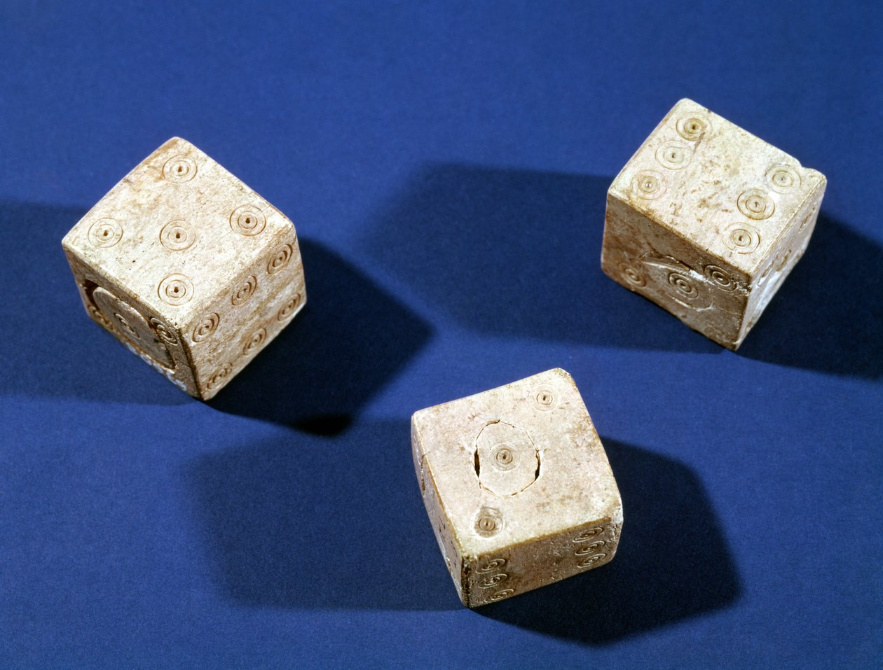 Trois dés, de l