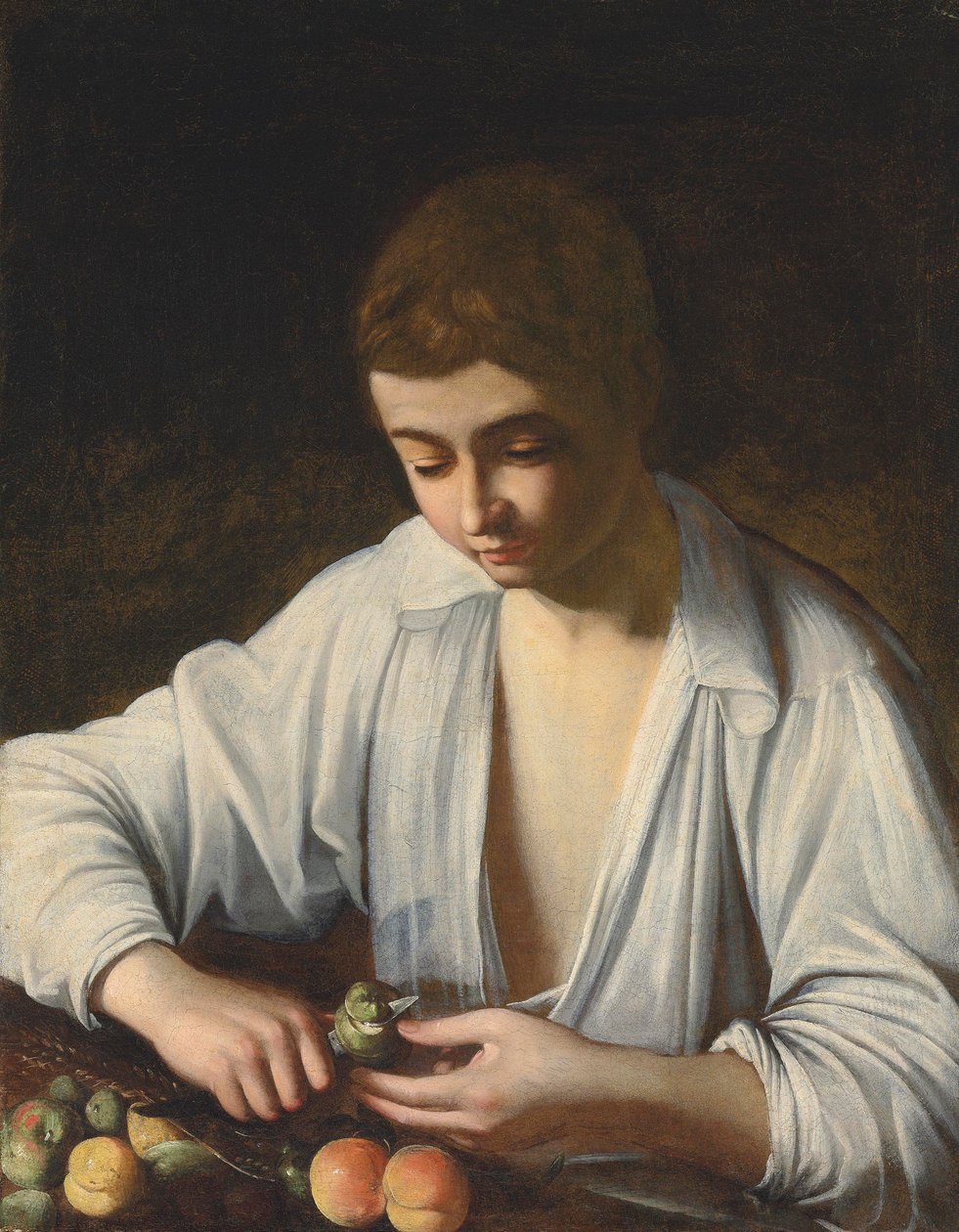 Un garçon épluchant un fruit - Michelangelo Merisi Caravaggio