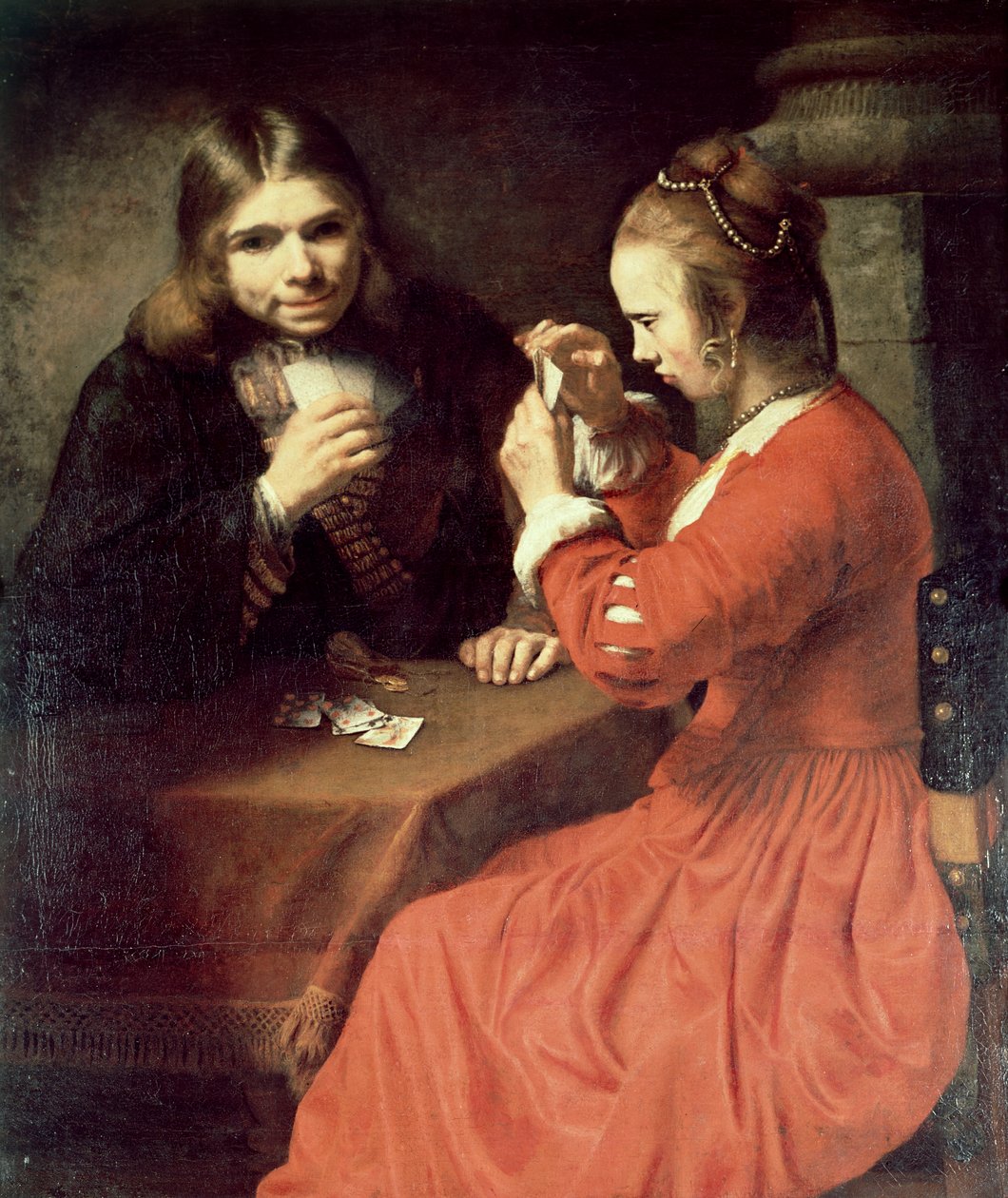 Un Jeune Homme et une Fille Jouant aux Cartes - Rembrandt van Rijn