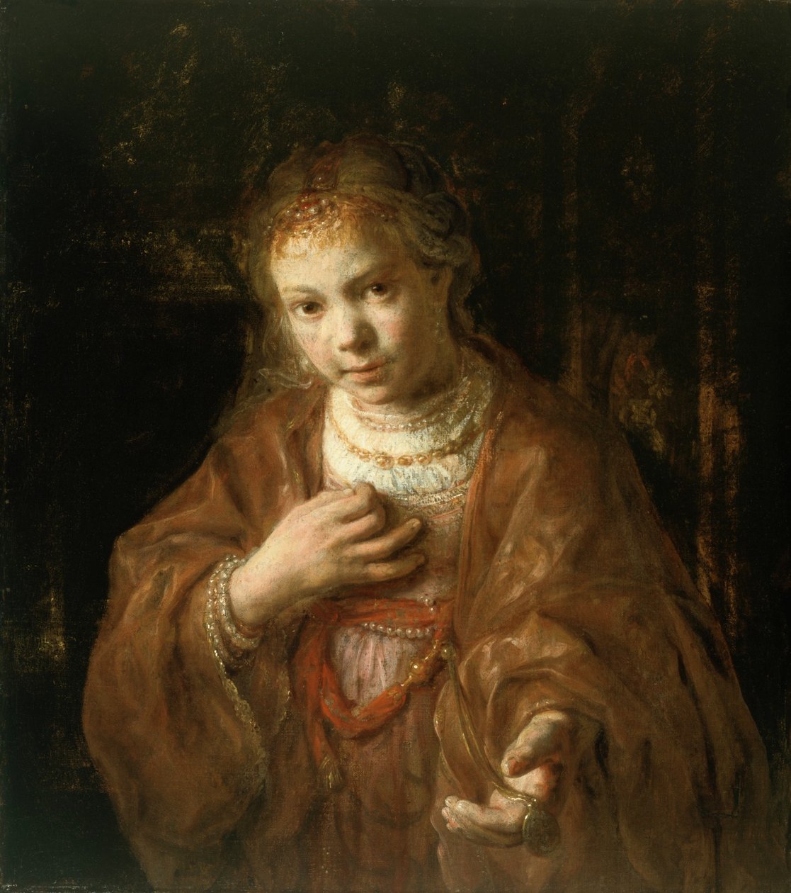 Jeune fille tenant une médaille - Rembrandt