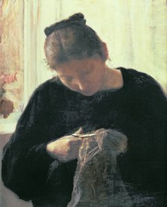 Une femme cousant