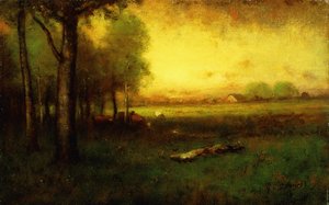 Vaches broutant au coucher du soleil